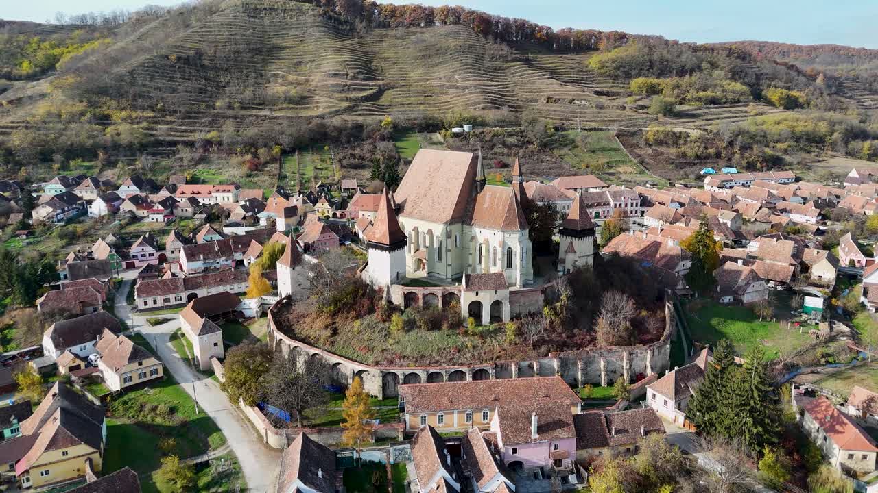 Capture the beauty of Biertan, Romania, with this stunning drone footage of its fortified medieval church during autumn.