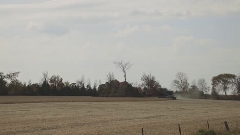 Agricultural-Combine-Harvester-Working-In-The-Field---Harvest-Season-In-Farm