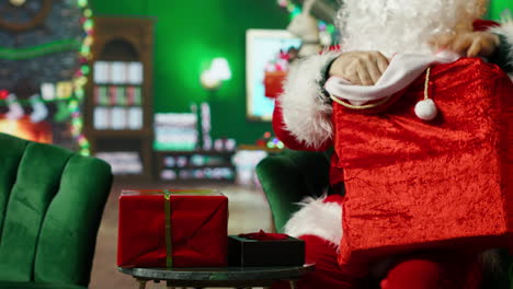 santa checking a christmas gift bag