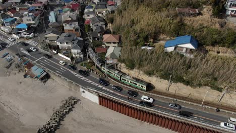 a train running by the sea