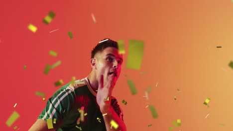 Animation-of-caucasian-male-soccer-player-over-confetti