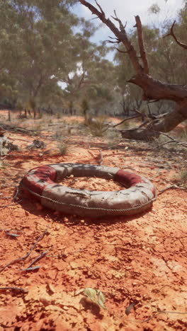 a life preserver lies abandoned in the australian outback.