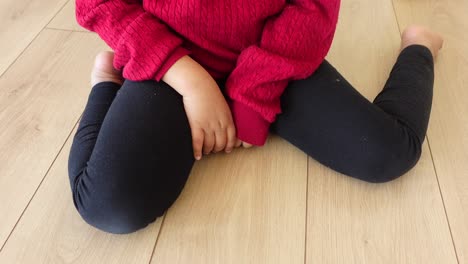 child sitting on the floor