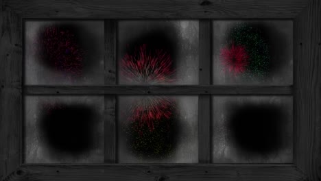 Animation-of-window-with-colourful-christmas-and-new-year-fireworks-exploding-in-night-sky