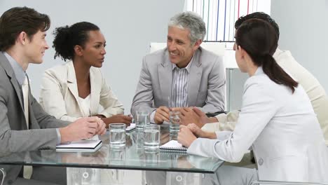 laughing businesspeople having a meeting