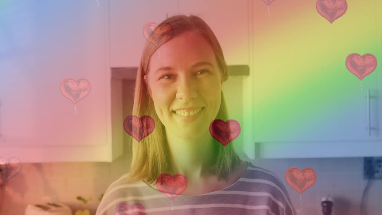 анимация с сердечными эмодзи и радужным флагом над улыбающейся кавказской женщиной.