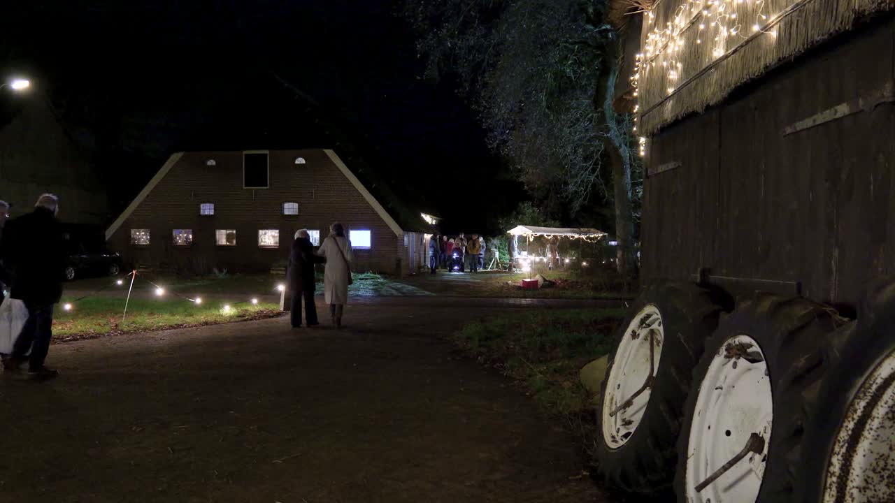 Nighttime Event with People and Festive Lights