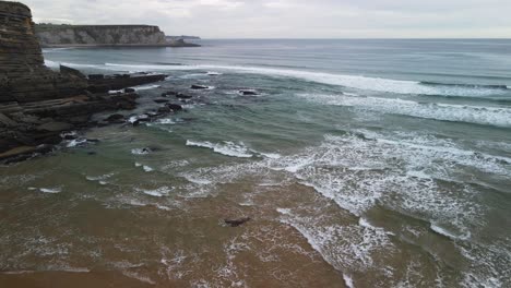 Aerial-over-ocean-cliff-waves-rolling-in-on-Cantabrian-sea-shoreline