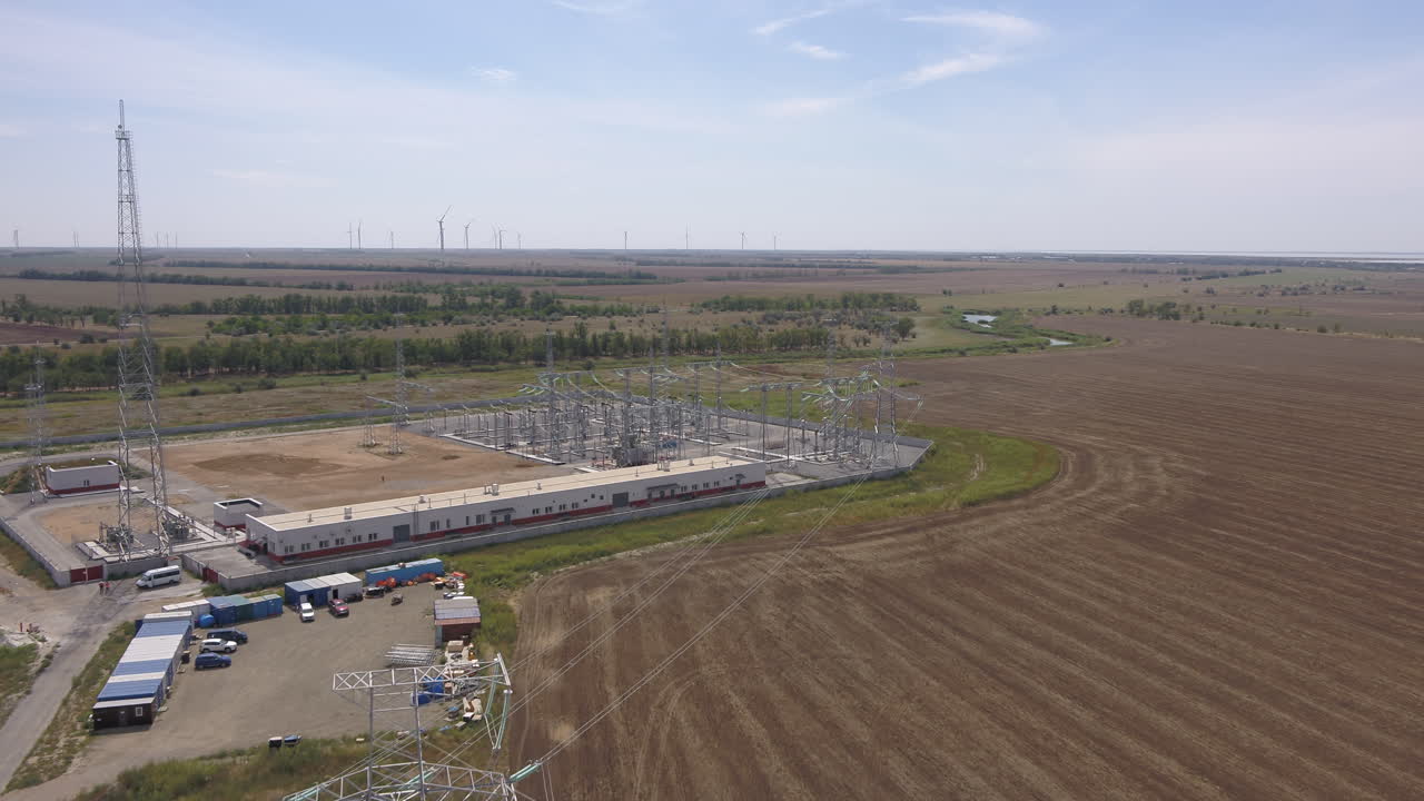 Aerial View of a Power Station and Wind Farm Complex
