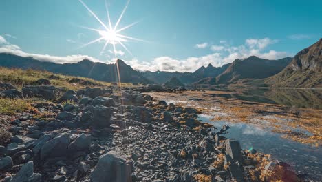 Bright-sun-above-fjord-shores-and-bottom-exposed-by-low-tide-and-covered-with-kelp-and-seaweed