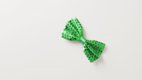 video of st patrick's green bow tie with copy space on white background