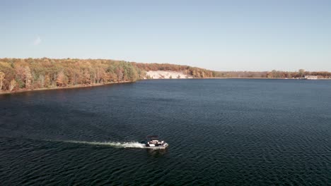 river boat on au sable river in michigan with drone video stable