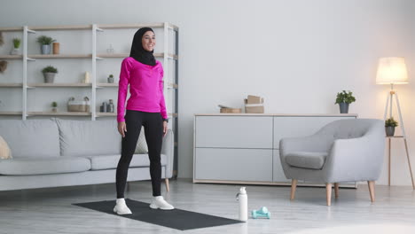 woman doing a home workout in a living room