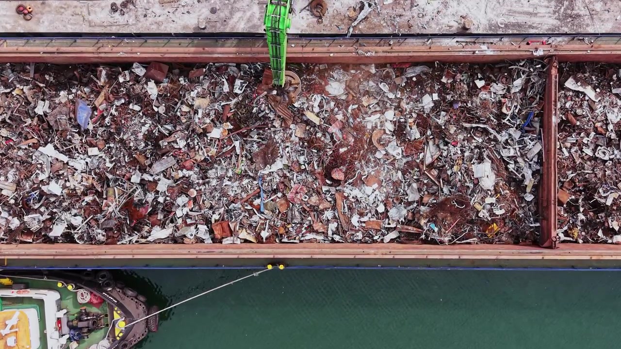 Waste collection in a shipping container at a harbor area near the river