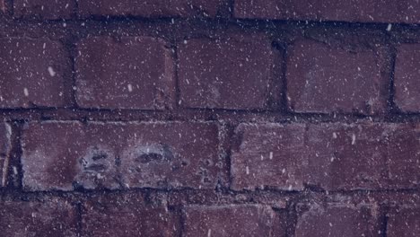 Animation-of-winter-scenery-snow-falling-against-brick-wall