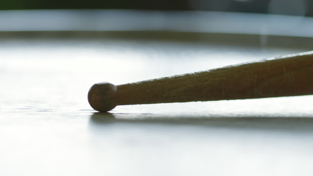 Close-up of a drumstick on a surface