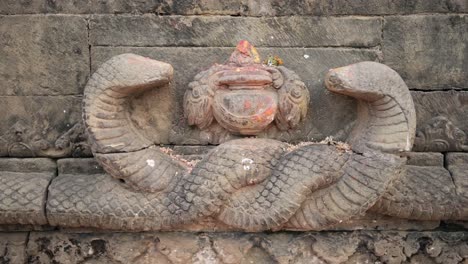 bhaktapur stone statue in a nepal temple, close up detail of statues in bhaktapur ancient city unesco world heritage site, a holy and sacred religious place popular as a tourist destination