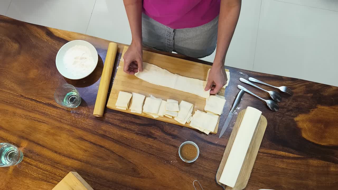 Overhead shot of dough preparation on wooden table