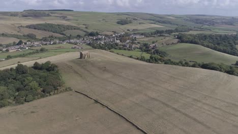 Aerial-tracking-from-right-to-left-high-above-the-Chapel-of-St-Catherine's-in-the-heart-of-Dorset,-near-the-village-of-Abbotsbury