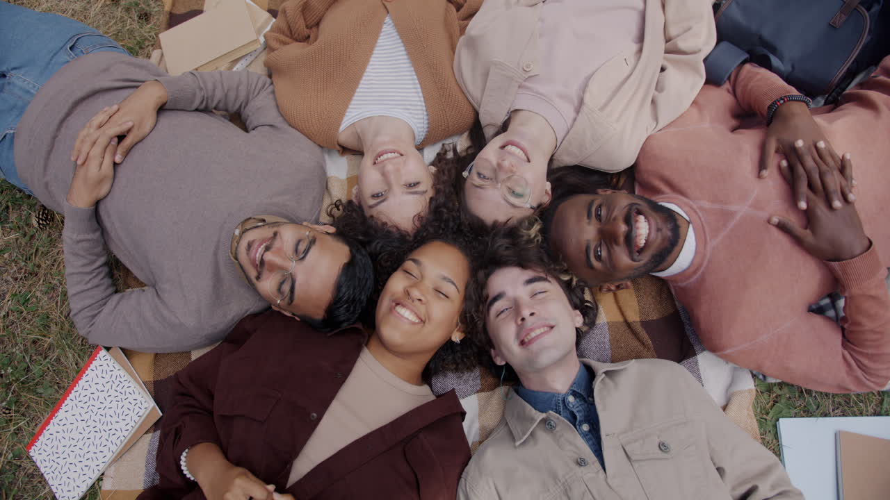 Friends Relaxing on a Plaid Blanket
