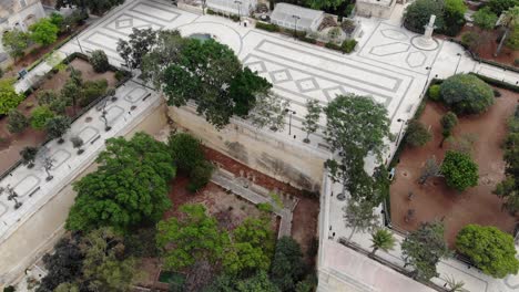 Aerial-view-of-trees-and-green-park-in-middle-of-mediterranean-city