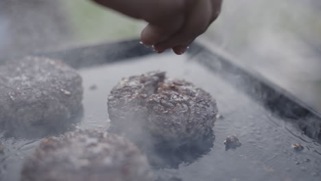 cooking burgers on a hot plate