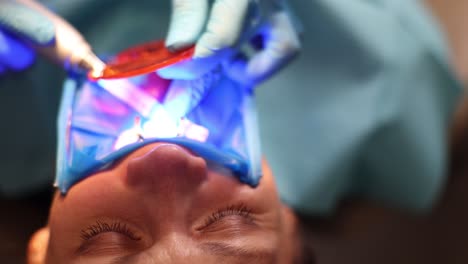 patient undergoing dental light-curing procedure