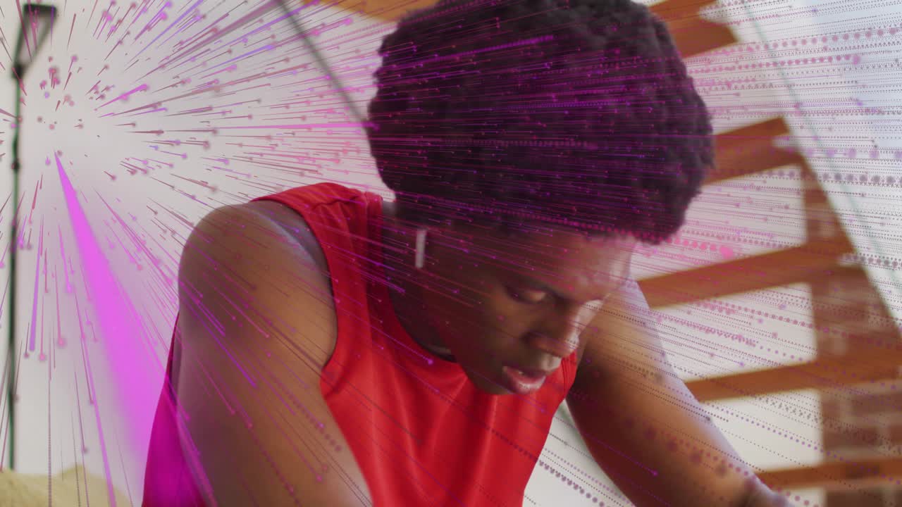 Man drinking blue bottle after workout, seeking recovery while purple-pink radial overlaying gym