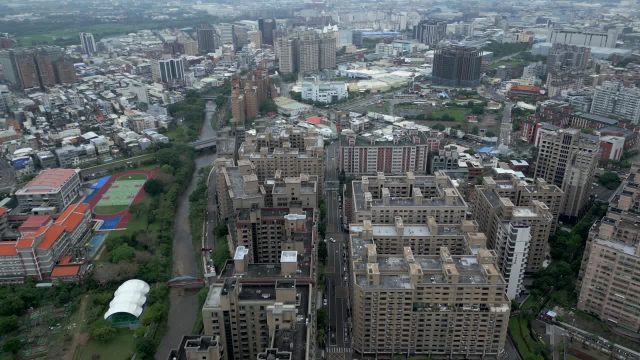 Aerial View Of Dense Urban Landscape With Mid-rise And High-rise Buildings Along Canal. Luzhu District, Taoyuan City, Taiwan.