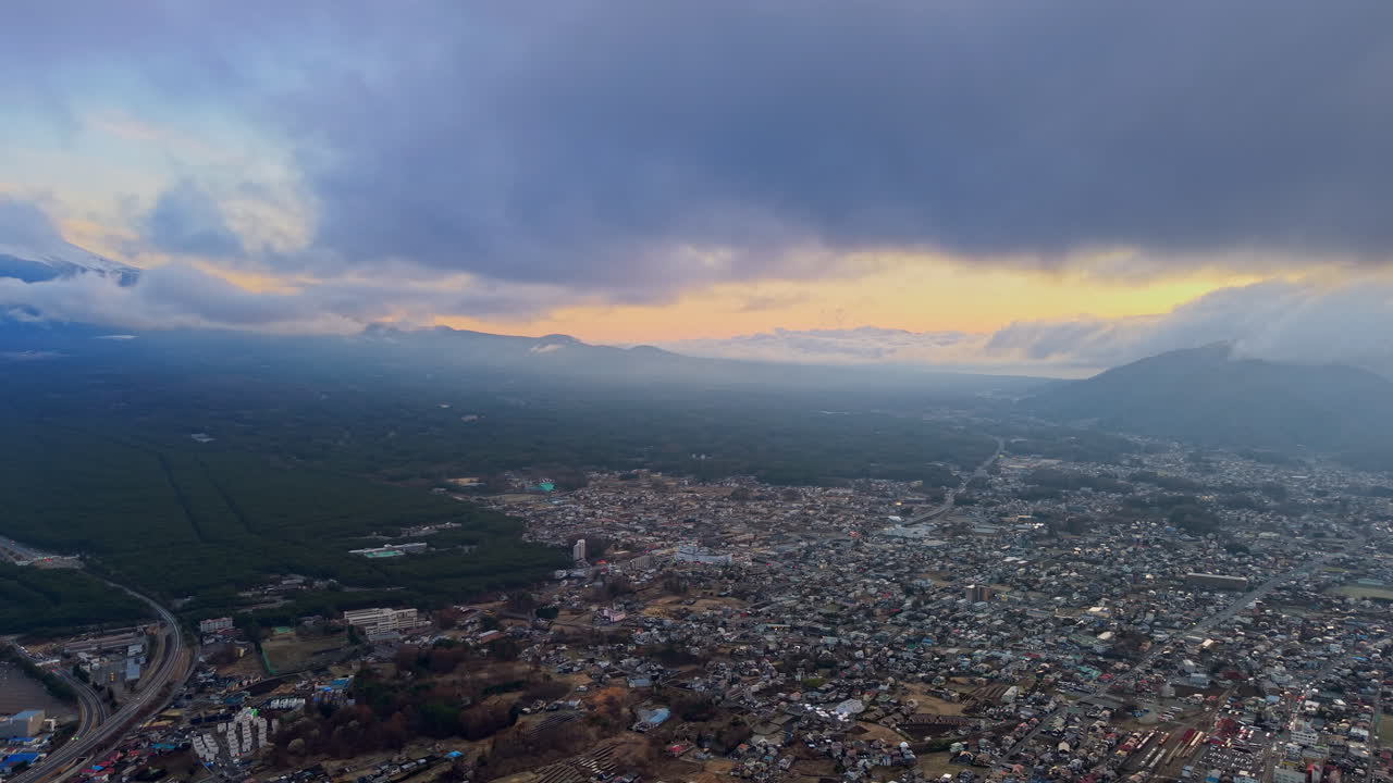 Aerial drone view of the Fujikawaguchiko town, Japan at the foothills of Mount Fuji in daylight
