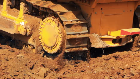 moving steel caterpillars of bulldozer. heavy machinery in mining industry