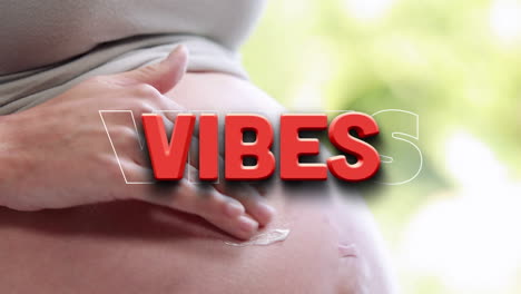 animation of vibes text over pregnant woman belly