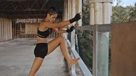 female athlete stretching outdoors