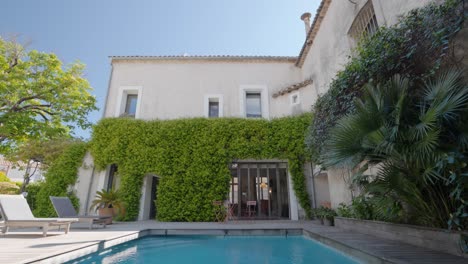 slow tilting shot of a luxury villa in baillargues with a beautiful private pool