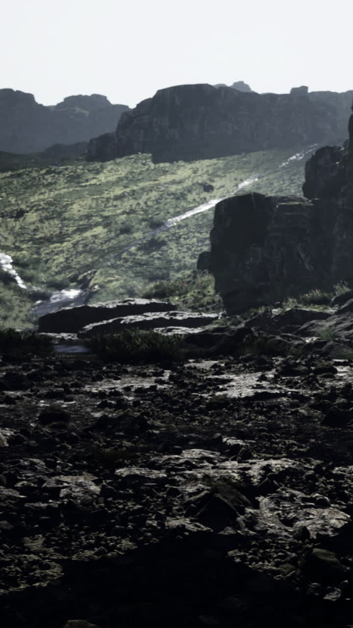 Mysterious rocky landscape with shadowed cliffs and illuminated terrain