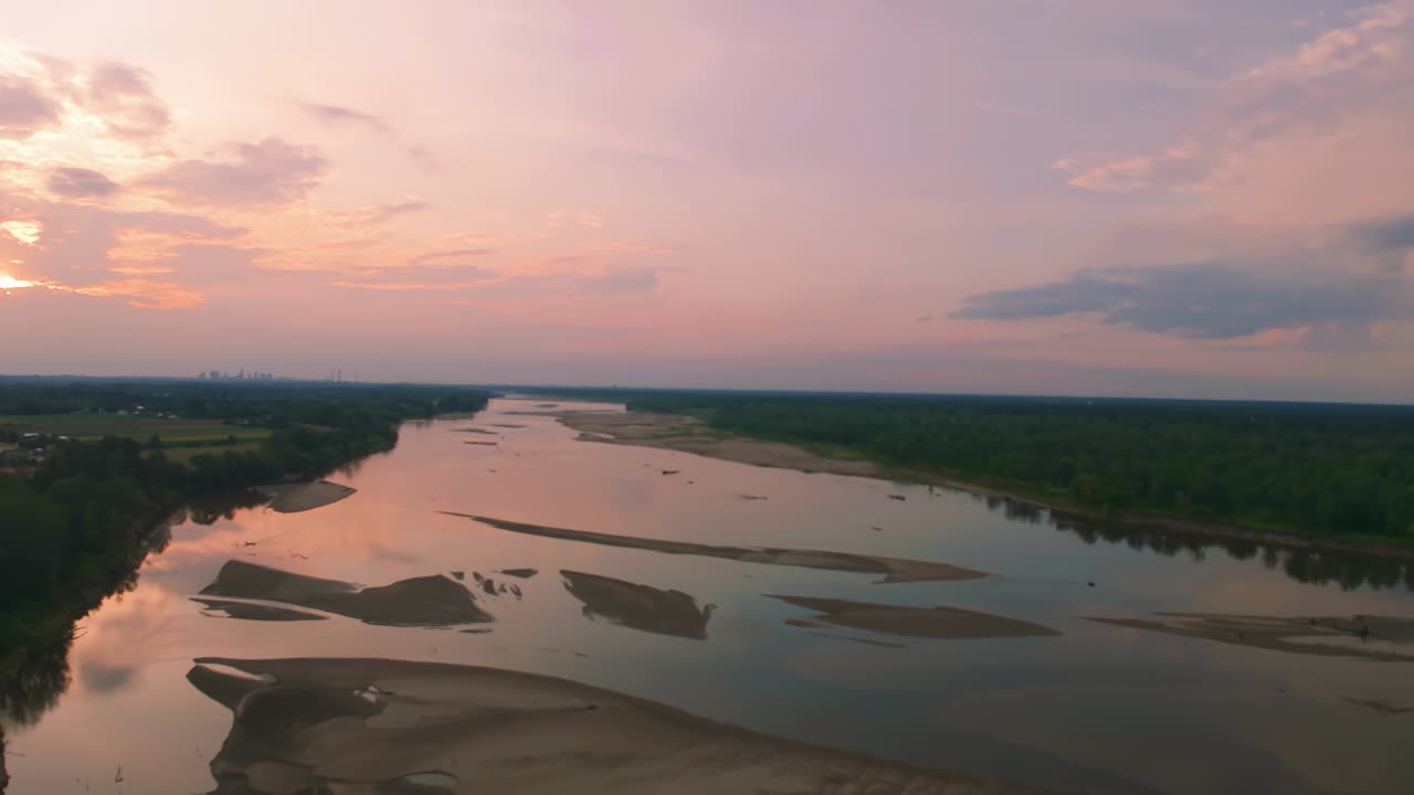 Aerial view of the Vistula, one of the last wild rivers in Europe, near Warsaw with naturally formed sandy islands, with very low water levels at the sunset