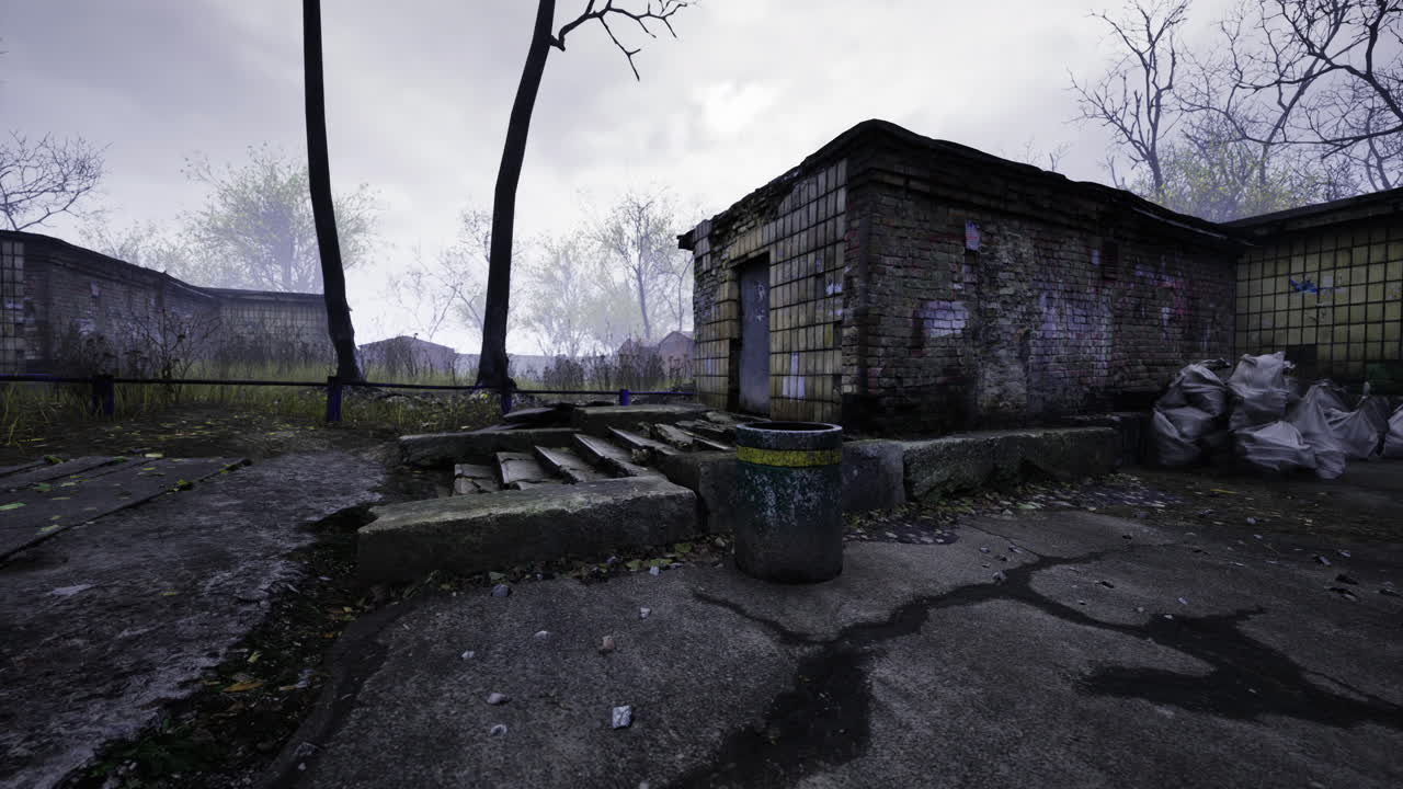 Abandoned buildings in a desolate landscape under a moody sky