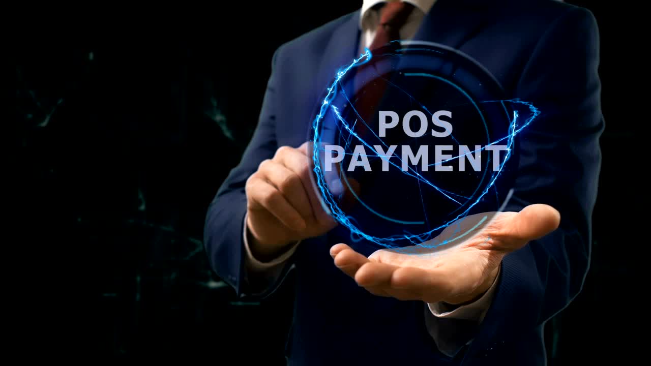 Businessman shows concept hologram POS Payment on his hand