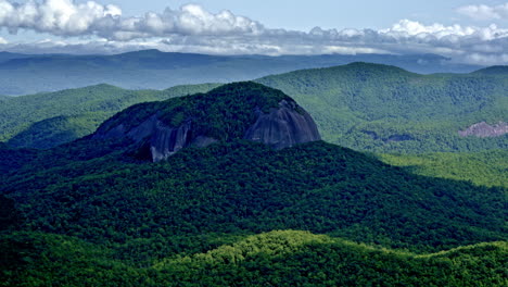 One bold mountain stands independently in a wide drone landscape shot