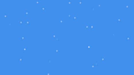 Glowing-snow-particles-falling-against-blue-background