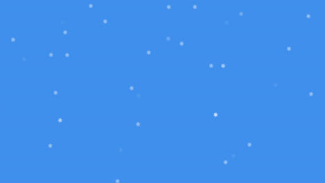 glowing snow particles falling against blue background