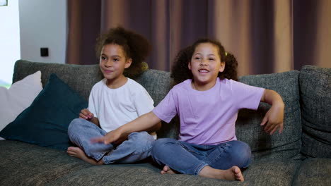 kids watching film at home