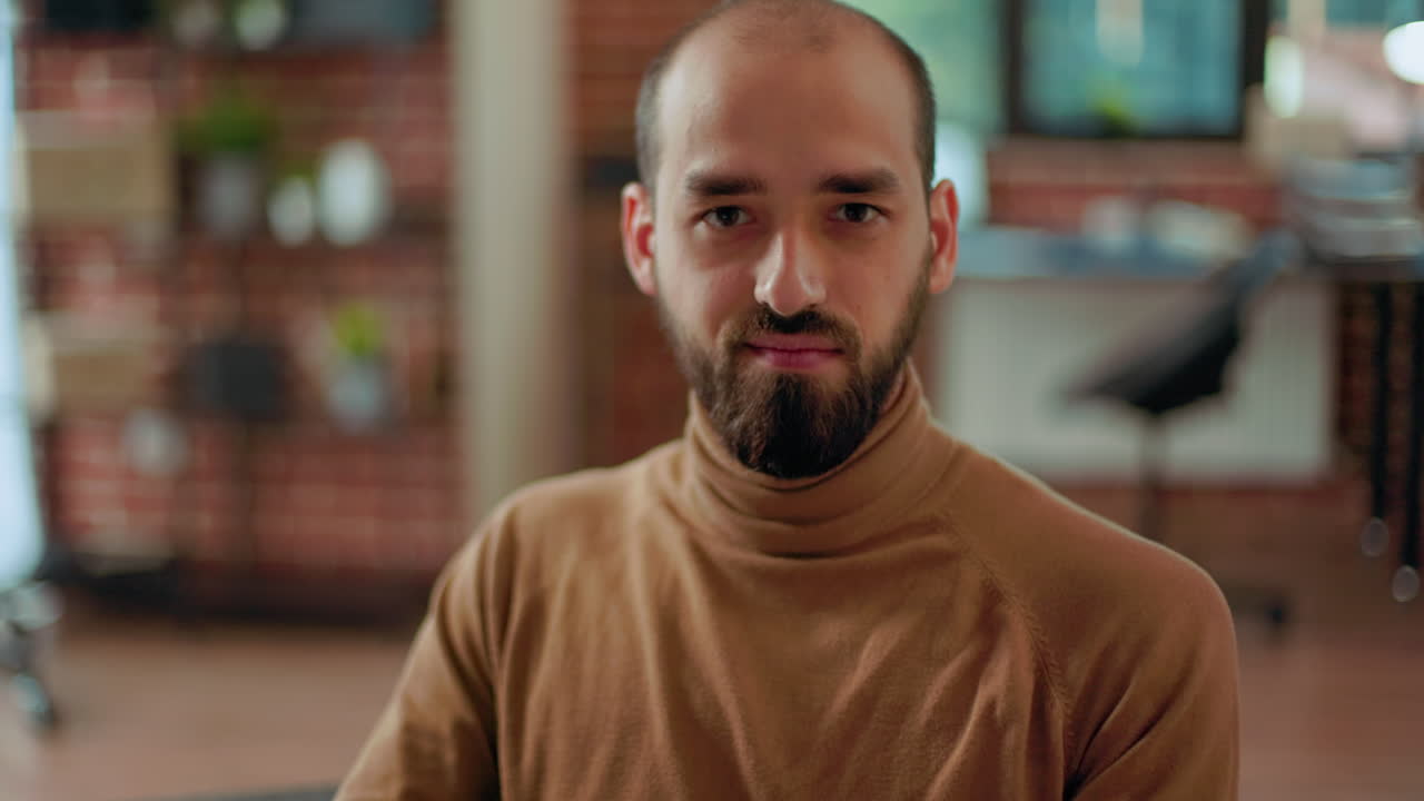 Portrait of a man with a beard in an office setting