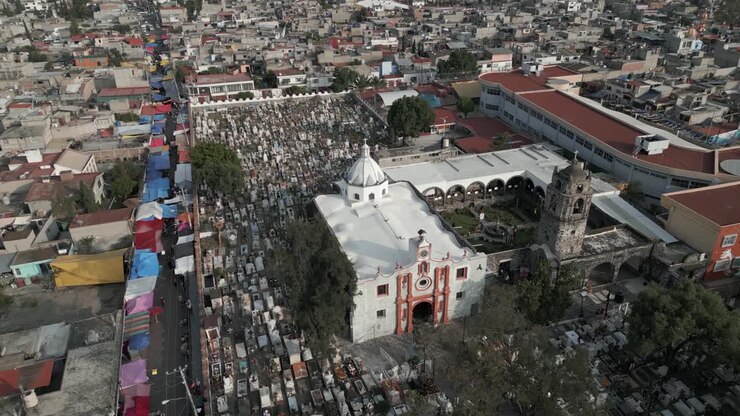 Flyover St Andrews Catholic church grave yard cemetery in Mixquic, MX