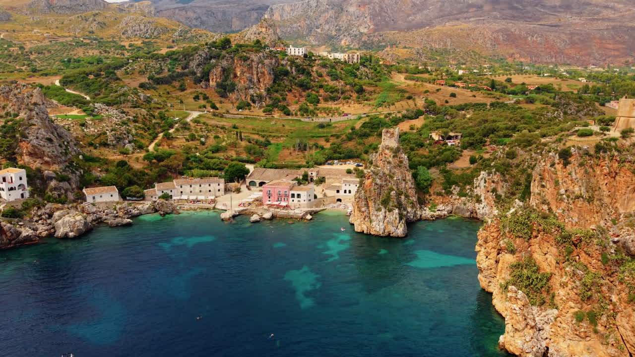 Tonnara di Scopello, An Old Tuna Fishery And Village On The Northwestern Coast Of Sicily, Italy. Aerial Drone Shot