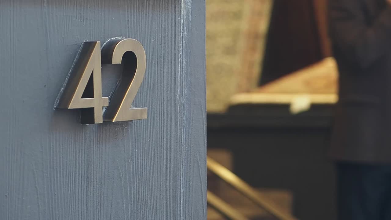 House Number 42 on a Grey Door