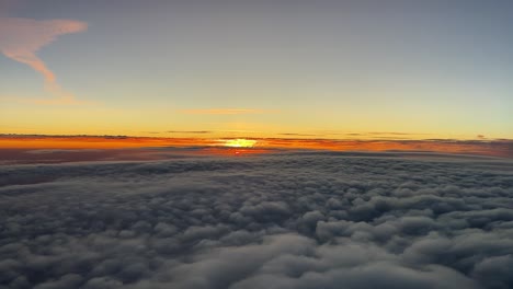 awesome sunset as seen by the pilot’s of a jet flying at 9000m high over a layer of clouds