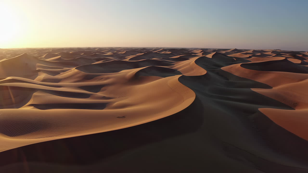 Vast Landscape of Desert Sand Dunes at Sunset