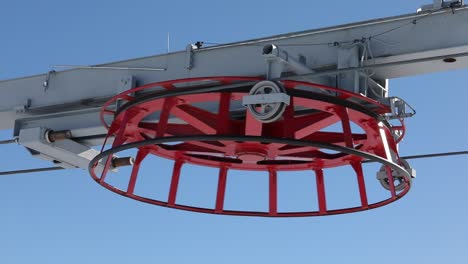 Ski-Lift-Rotating-Wheel-Pulley-System-with-Gondola-Chair,-Close-Up-Shot