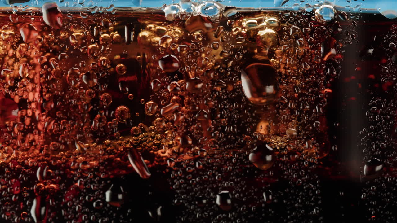 Close-up of a glass of cold soda with ice